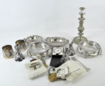 A collection of silver plated wares, including single candlestick,
