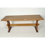 A mid-century oak hall bench, with carved base,