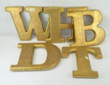 Five large gold painted wood letters, B, D, H, M, T,