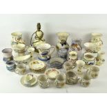 A collection of assorted Honiton ceramics and similar pieces, including vases and teacups,