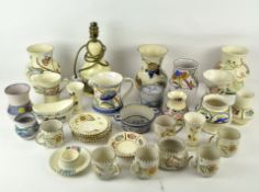 A collection of assorted Honiton ceramics and similar pieces, including vases and teacups,