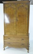 A walnut Queen Anne style wardrobe on stand marked "Dillon",