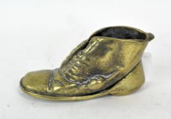 A small vintage brass boot holder with crawling mouse on the side, marked Elpec Reg to base,