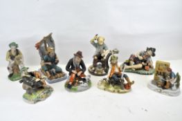 A collection of Portuguese bisque figures including a cobbler, fisherman, blacksmith, and more, max.