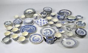 An extensive collection of blue and white ceramics, including Old Willow tableware and others