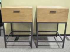 Two modern wood side tables with drawer on a black metal support,