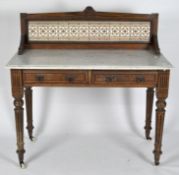 An early 20th century marble topped washstand with brown and white tiles to splashback and two