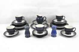 A blue and white Denby part dinner service with plates, cups, salt and pepper pots,