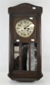 An early 20th century oak cased wall clock, Fontenoy Fontenay, with part glazed door,