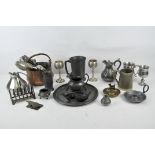 A group of silver plate and pewter including flatware, tankards, goblets and dishes,