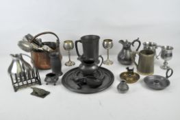 A group of silver plate and pewter including flatware, tankards, goblets and dishes,