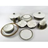 A Poole pottery part dinner set, most being green and white in colour, including dinner plates,