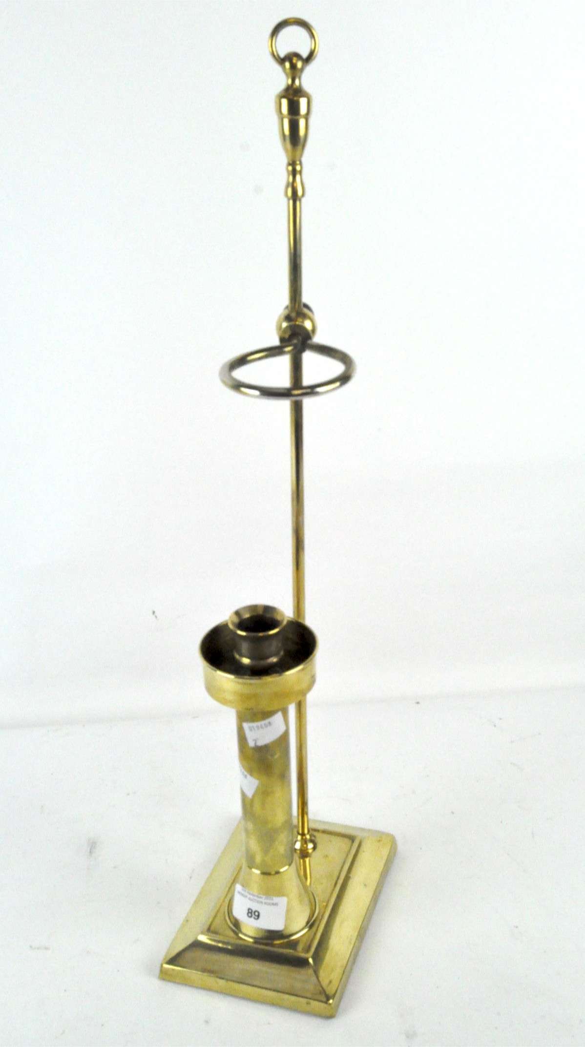An unusual adjustable brass candlestick,