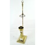 An unusual adjustable brass candlestick,