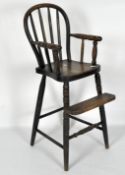A Victorian child's spindle back high chair with foot rest, on turned supports,