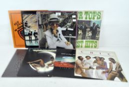 A selection of vintage vinyl records, to include Elton John greatest hits,