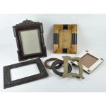 A selection of photograph frames, including a bone inlaid example and numerous others,