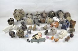 A large collection of model pigs, mostly ceramic,