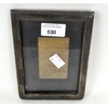 A silver mounted photo frame of rectangular form, hallmarked Birmingham 1945 by S B,