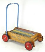 A Triang baby walker with complete set of coloured blocks,