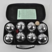 A cased set of metal Jaques Boules petanque balls