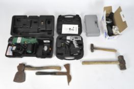 A group of tools to include an angle grinder, electric drill, a cordless power lopper, axes,