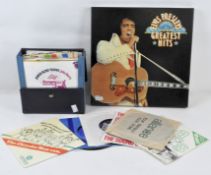 A selection of vinyls, including a boxed set 'Elvis Presley's Greatest Hits' containing 6 LPs,