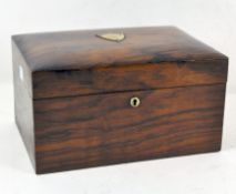 An Edwardian mahogany jewellery box, opening to reveal fitted tray over a storage space,