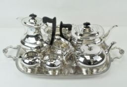 Two silver plated tea sets and a serving tray and coffee pot, length of tray including handles 59cm,