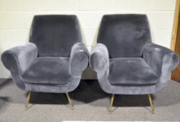 Two modern grey velvet armchairs, on splayed metal supports,