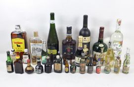 A selection of alcohol, to include Jim Bean Double Oak, and a collection of miniatures,