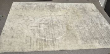 A large modern grey floor rug,