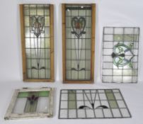 Five pieces of leaded stained glass, comprising two of rectangular form, wooden framed,