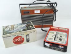 A Roberts RP26 vintage radio with a GT32 Sunpak Electric Flash Unit and an ALTA1 VOM Multitester