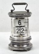 An early 20th century Chronos ticket clock of cylindrical white metal and glass, by Ever Ready,