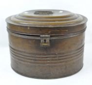An antique large oval metal hat box, ribbed to the body and with a handle to the lid,