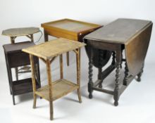 An early/mid-20th century oak drop leaf dining table together with four other side tables