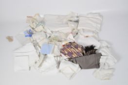 A quantity of vintage linen including napkins and tablecloths, some with embroidered decoration,