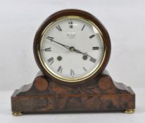 A contemporary stained wood Comitti of London mantel clock,