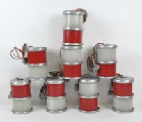 Eight studio lamps, of red and white plastic encased in white metal,