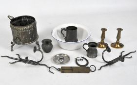 An assortment of metalware, including a pair of brass candlesticks and pair of candle sconces,