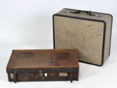 A 20th century leather suitcase with various travel labels, together with another travelling case,