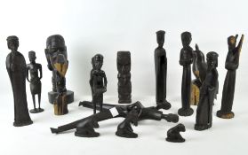 A collection of assorted African tribal wooden carvings,