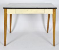 A mid-century enamel topped table, white enamel with black border, raised on splayed tapering legs,