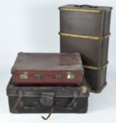 Two travelling trunks and a vintage suitcase,