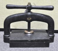 A 19th century heavy cast iron book press,