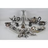 A collection of metalware, including a silver plated teapot, pewter tankards and vases,