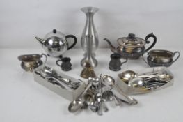 A collection of metalware, including a silver plated teapot, pewter tankards and vases,