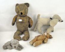 A group of four vintage soft toys, comprising two teddy bears, the largest 55cm,