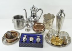 A collection of metal and silver plate including a condiment set, coasters and other items